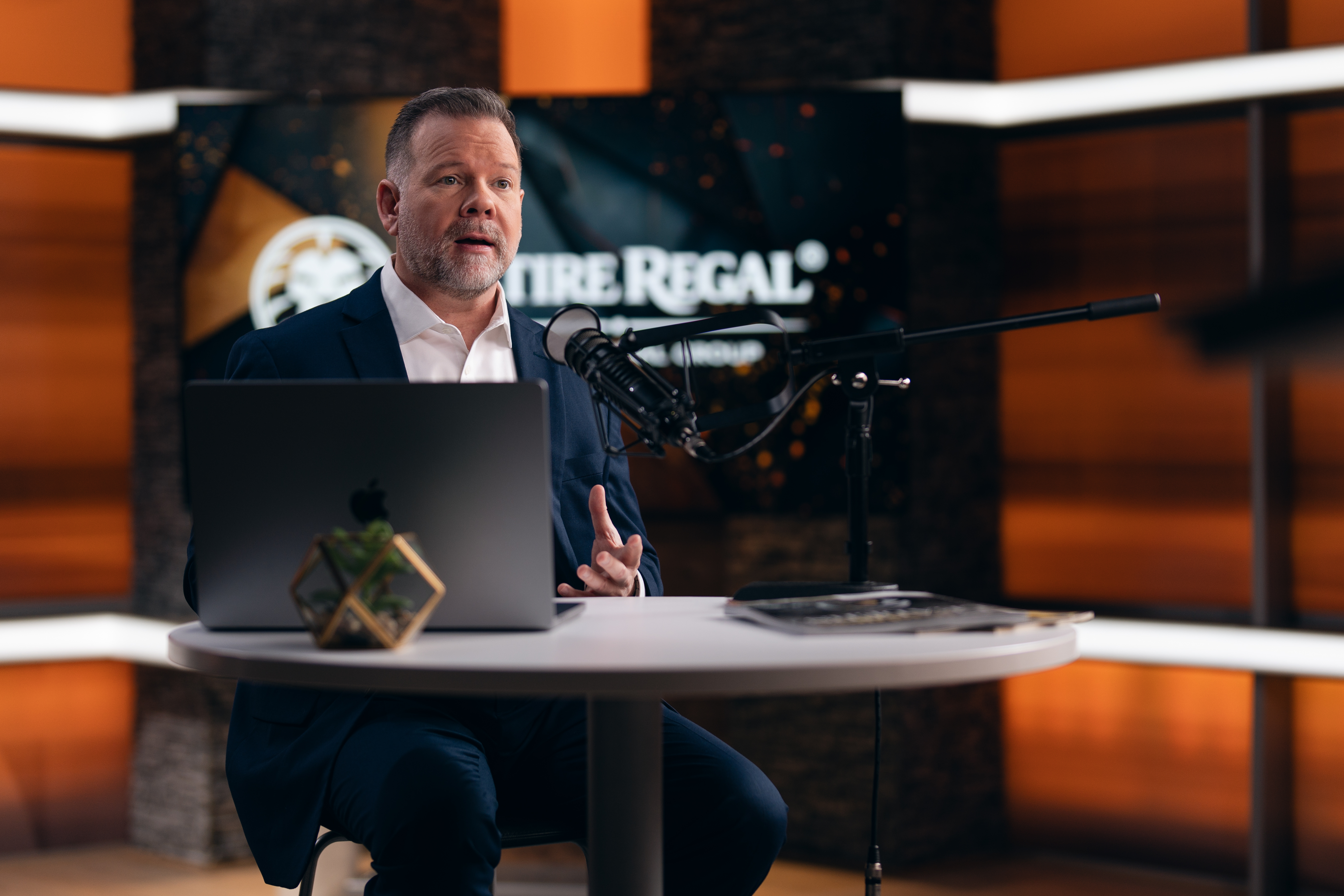 Chris Owens — wider angle at Retire REGAL branded desk