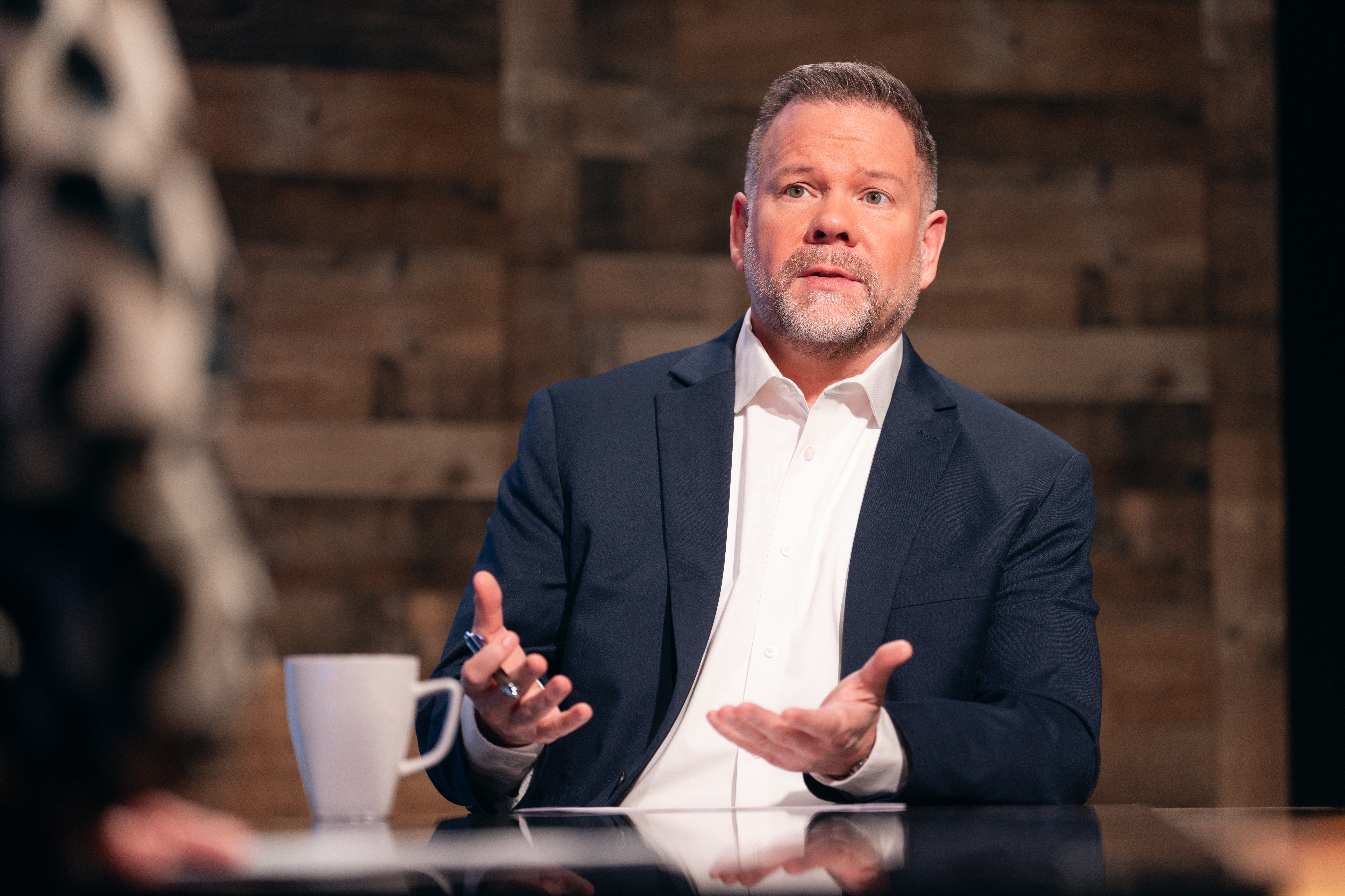 Chris Owens — in discussion at interview desk